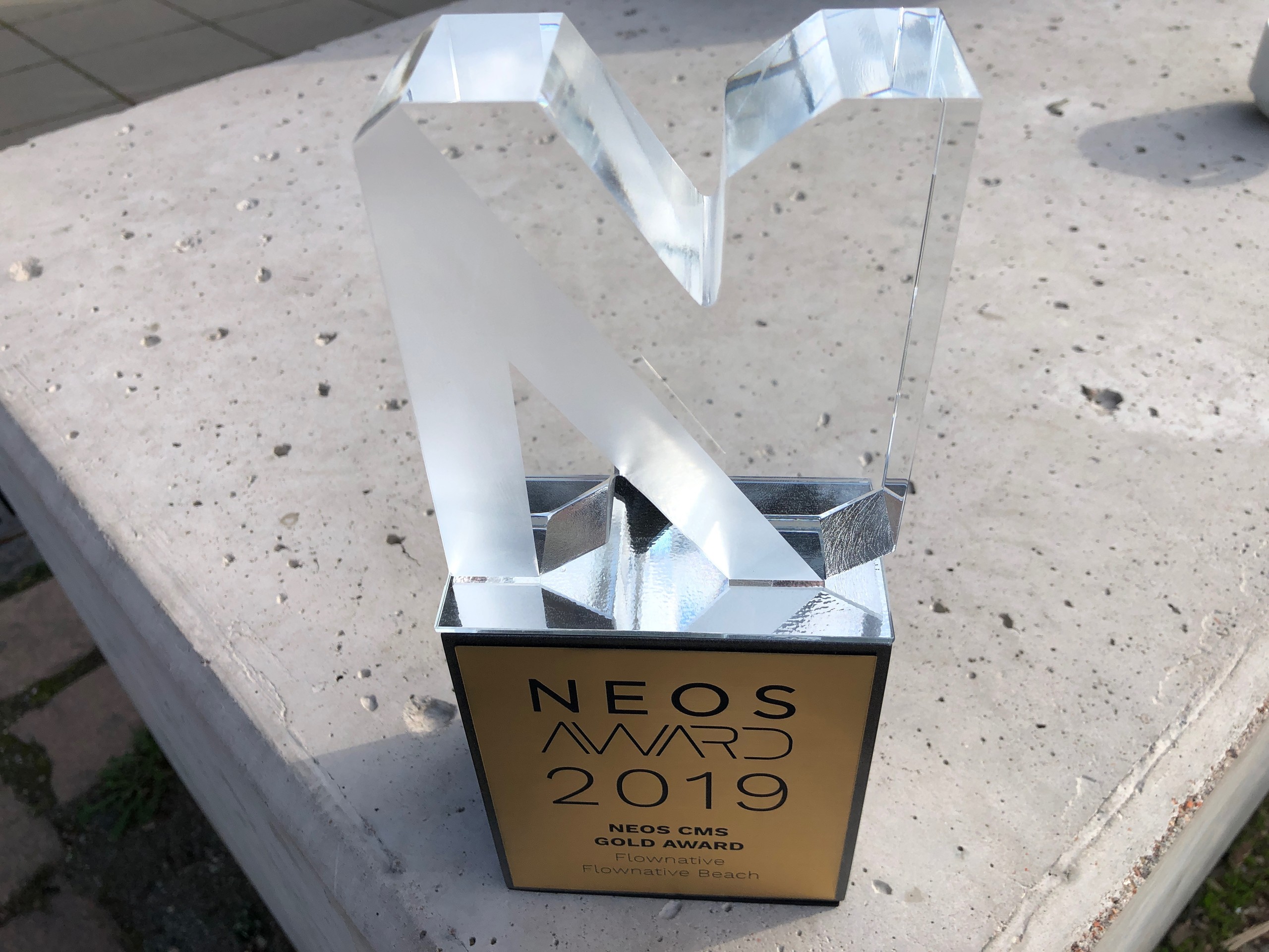 The Neos CMS Gold Award trophy